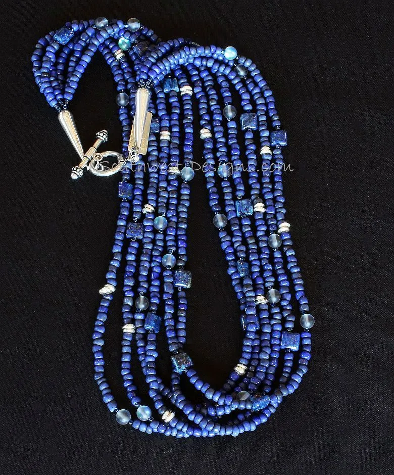 Blue Indonesian Glass 6-Strand Necklace with Lapis Squares, Blue Crystal Rounds, Iridescent Blue Seed Beads, and Sterling Silver Discs, Cones and Toggle Clasp