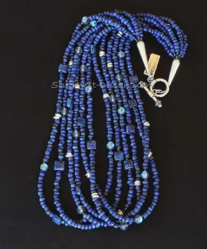 Blue Indonesian Glass 6-Strand Necklace with Lapis Squares, Blue Crystal Rounds, Iridescent Blue Seed Beads, and Sterling Silver Discs, Cones and Toggle Clasp