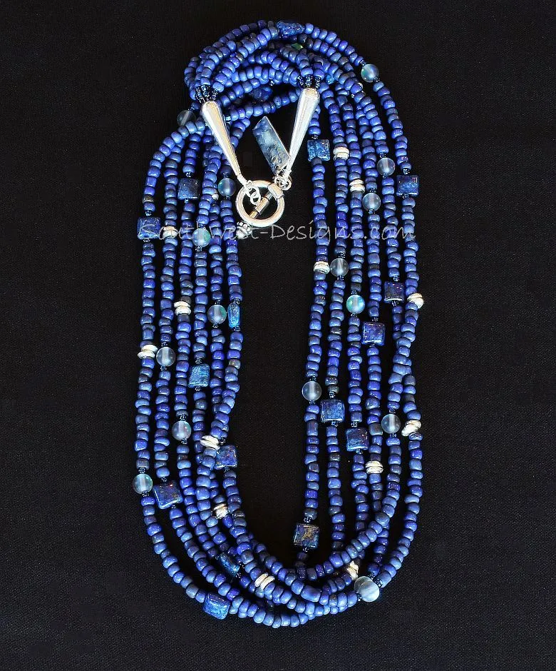 Blue Indonesian Glass 6-Strand Necklace with Lapis Squares, Blue Crystal Rounds, Iridescent Blue Seed Beads, and Sterling Silver Discs, Cones and Toggle Clasp