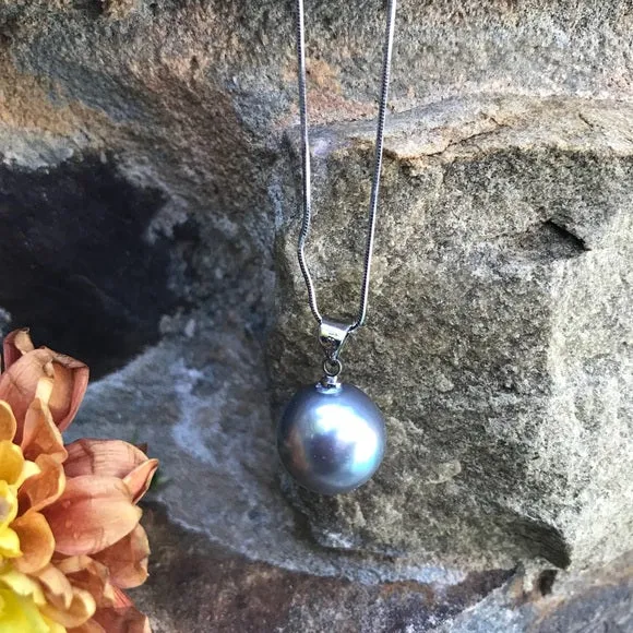 Large mother of single pearl on silver chain