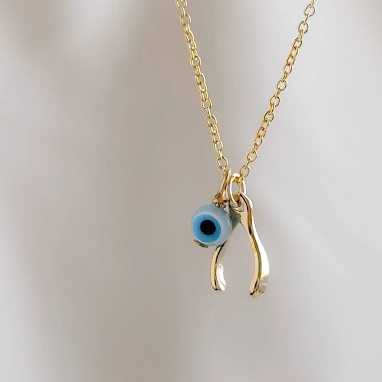 Tiny Wishbone & Evil Eye Necklace